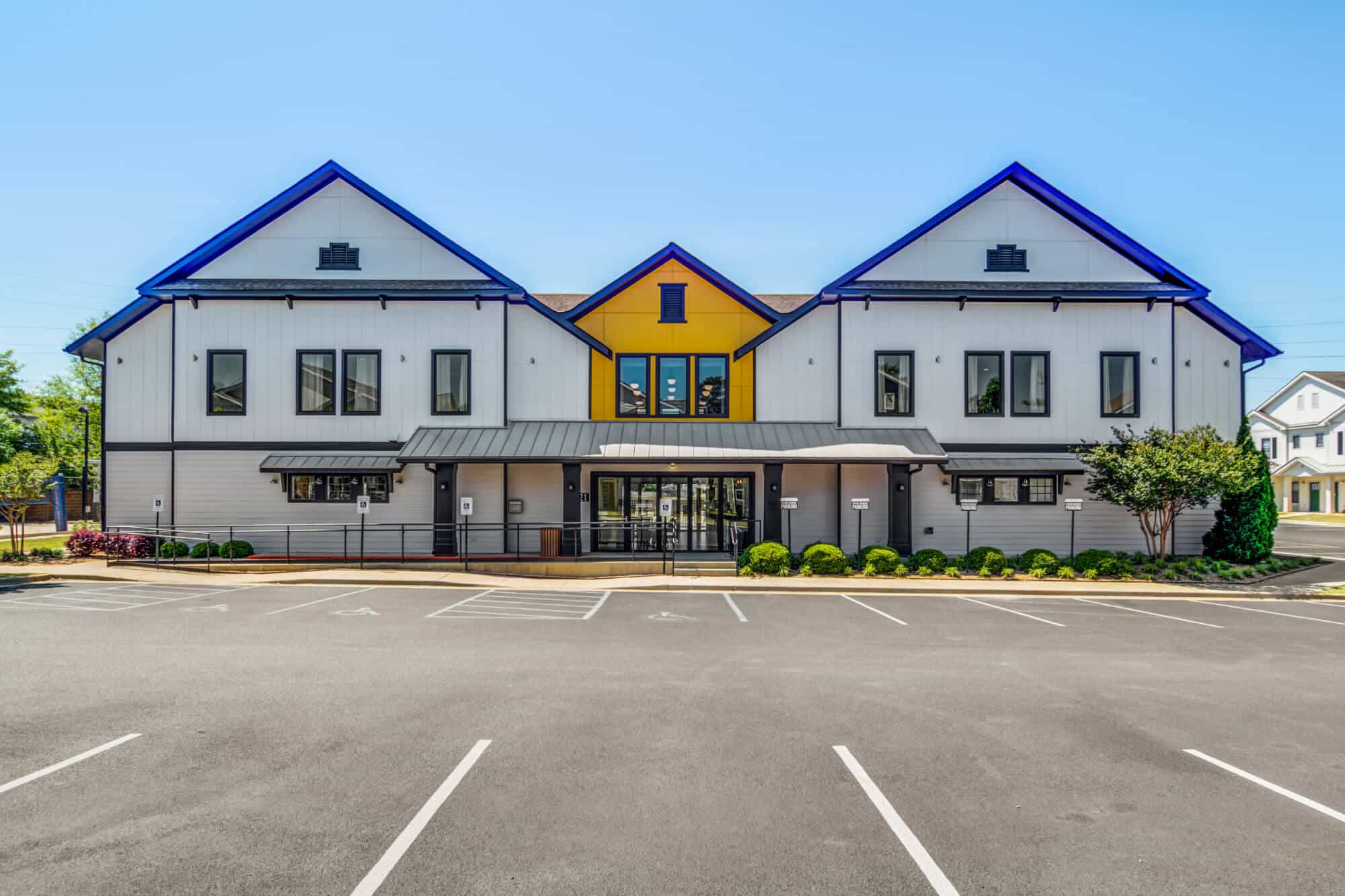 the collective at auburn luxury off campus cottage apartments near auburn university leasing office and resident clubhouse exterior