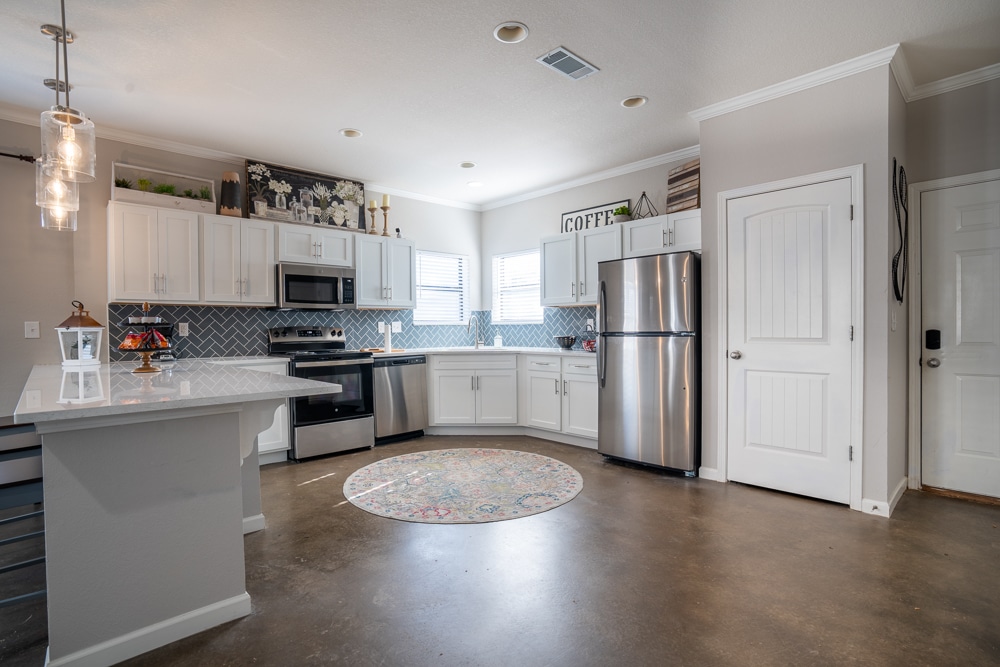 the collective at auburn apartments near auburn university spacious kitchen with pantry and stainless steel appliances