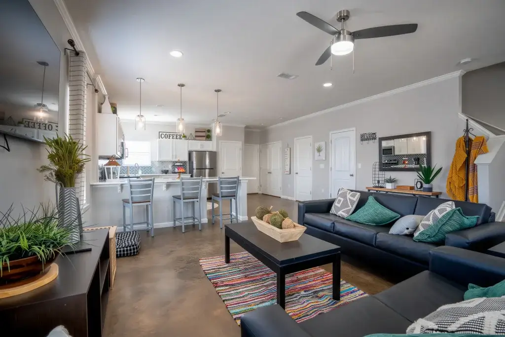 the collective at auburn apartments near auburn university living room stained concrete flooring 1