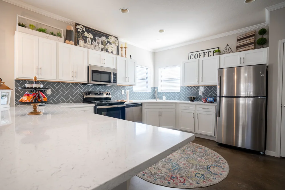 the collective at auburn apartments near auburn university upgraded kitchens quartz and granite countertops and stainless steel appliances