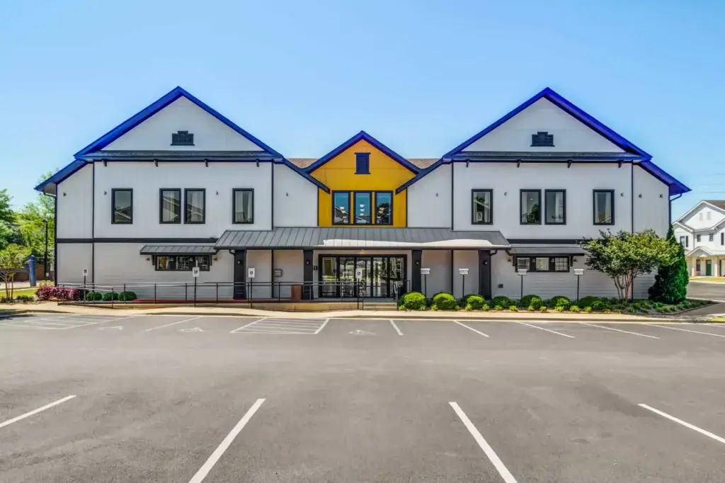 the collective at auburn luxury off campus cottage apartments near auburn university leasing office and resident clubhouse exterior 2