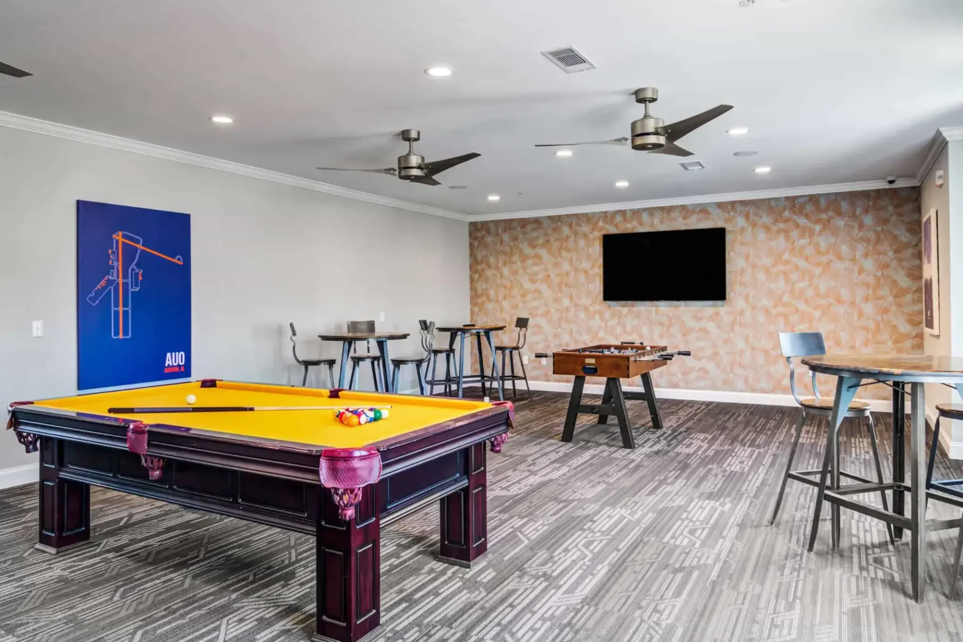 the collective at auburn luxury off campus cottage apartments near auburn university resident clubhouse game room with billiards and foosball tables 2